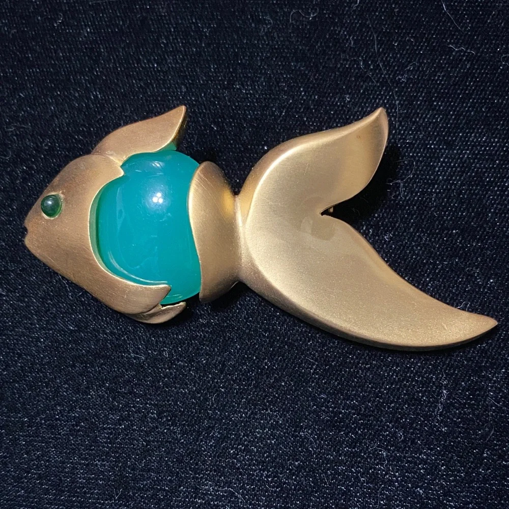 Givenchy vintage Matt gold tone with faux jade belly and eye brooch